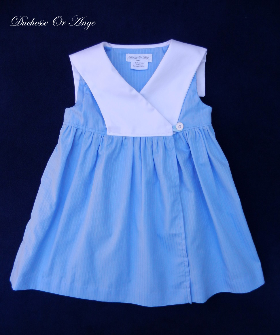 Blue wrapover baby dress with white sailor collar